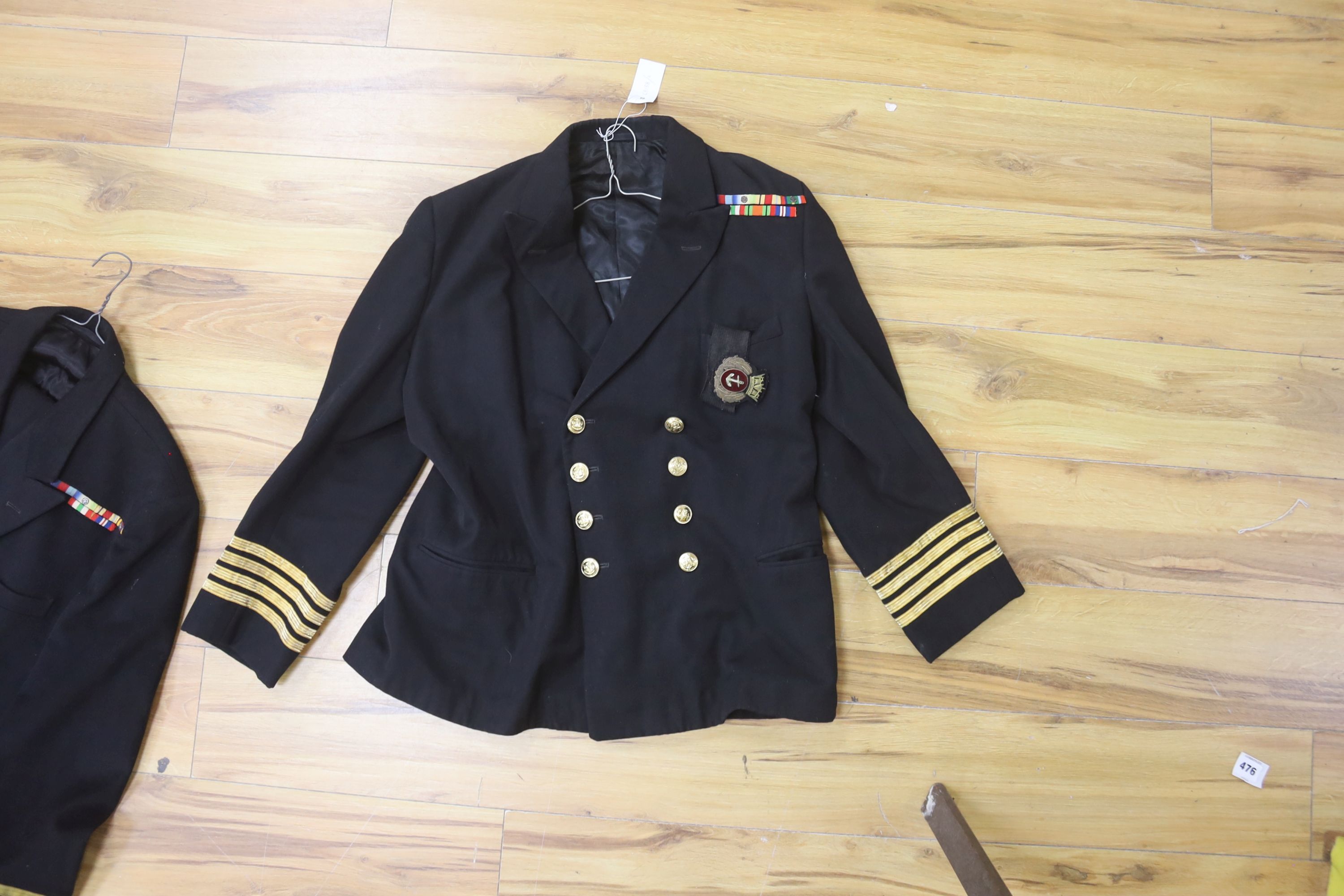 Two Royal Navy Captains jackets and associated trousers